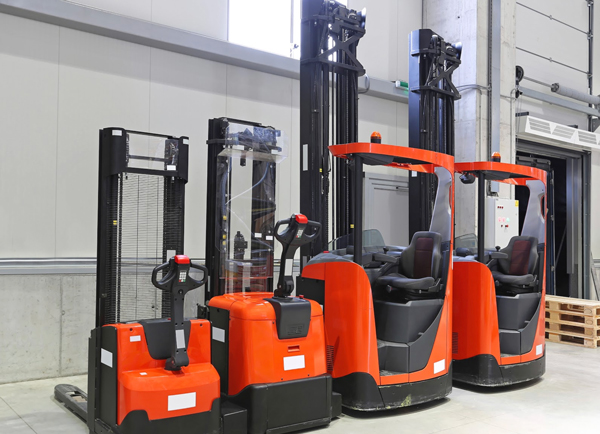 Small used forklifts for sale in a warehouse